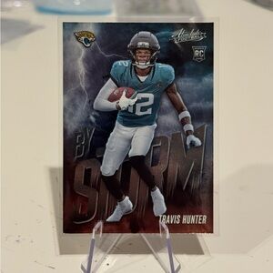 🔥 2025 Travis Hunter Panini Absolute By Storm Rookie Card. Jacksonville Jaguars.